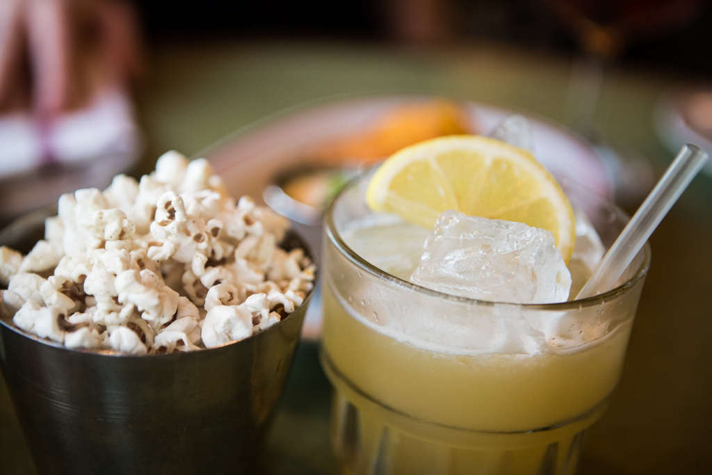 El Paso Sours and toasted popcorn with Old Bay Spice Seasoning