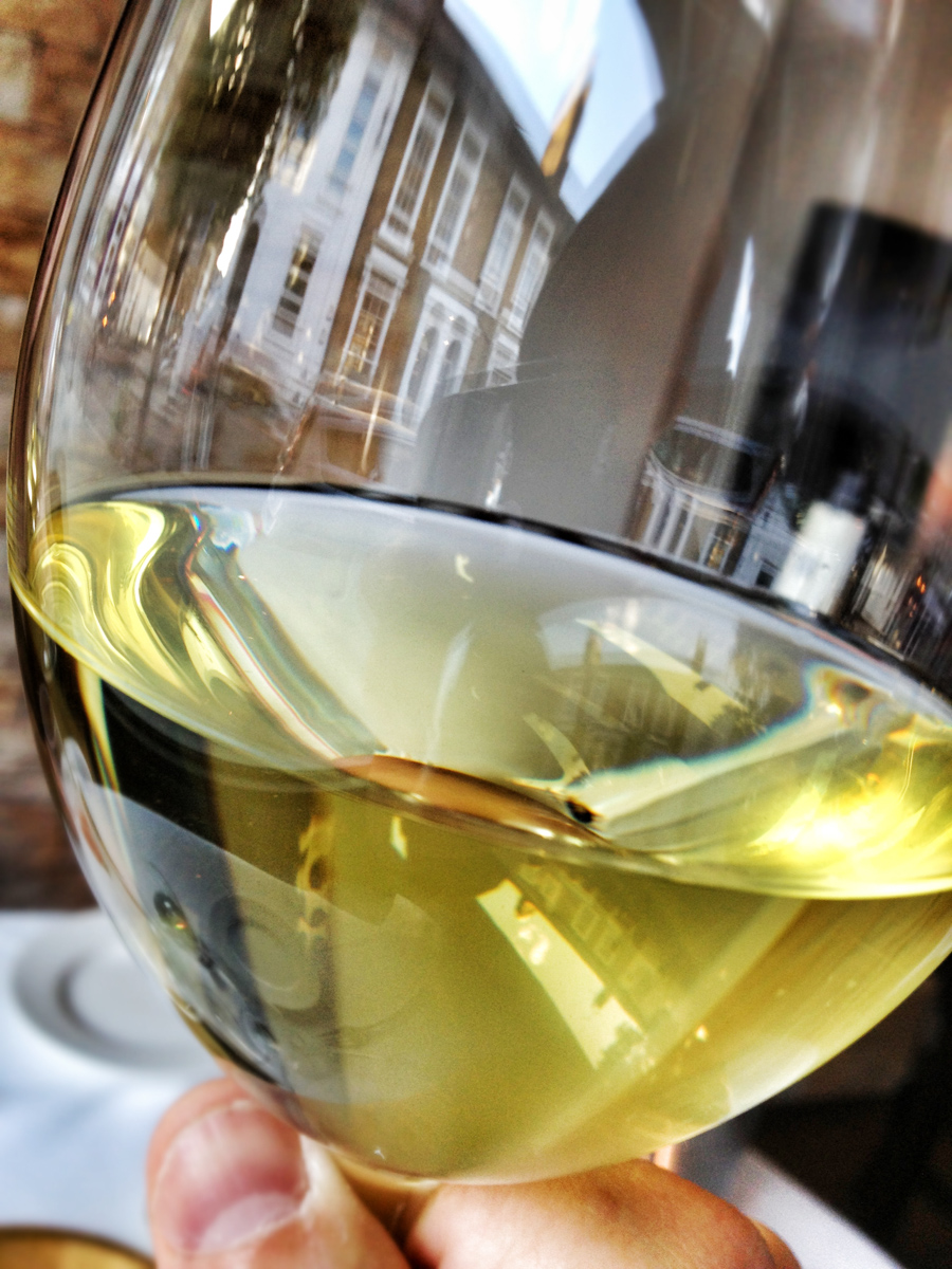 Devonshire Road reflected in a wine glass